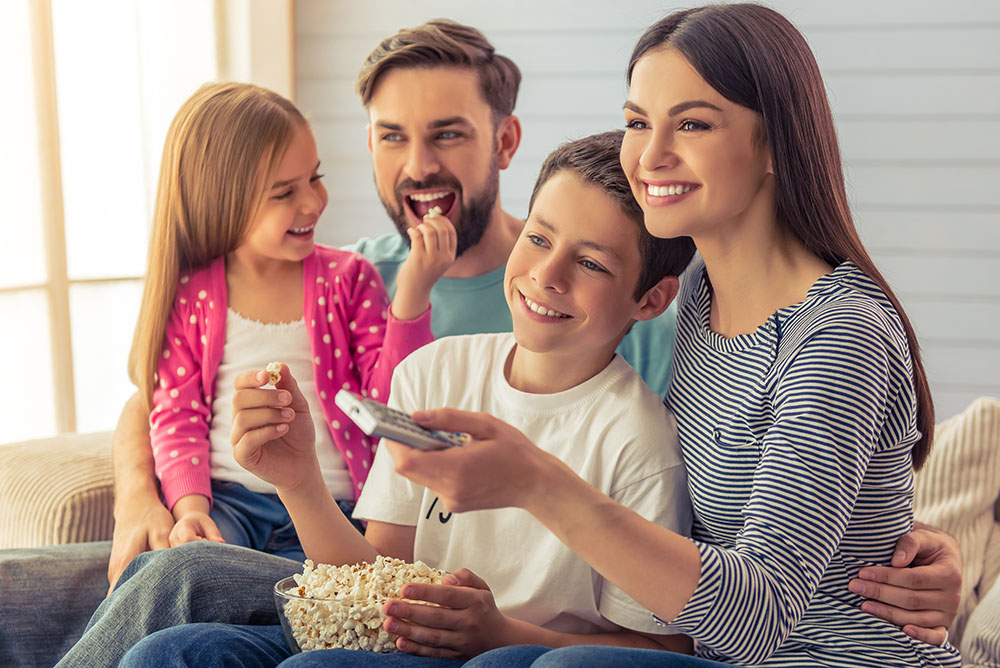 Family at home watching TV